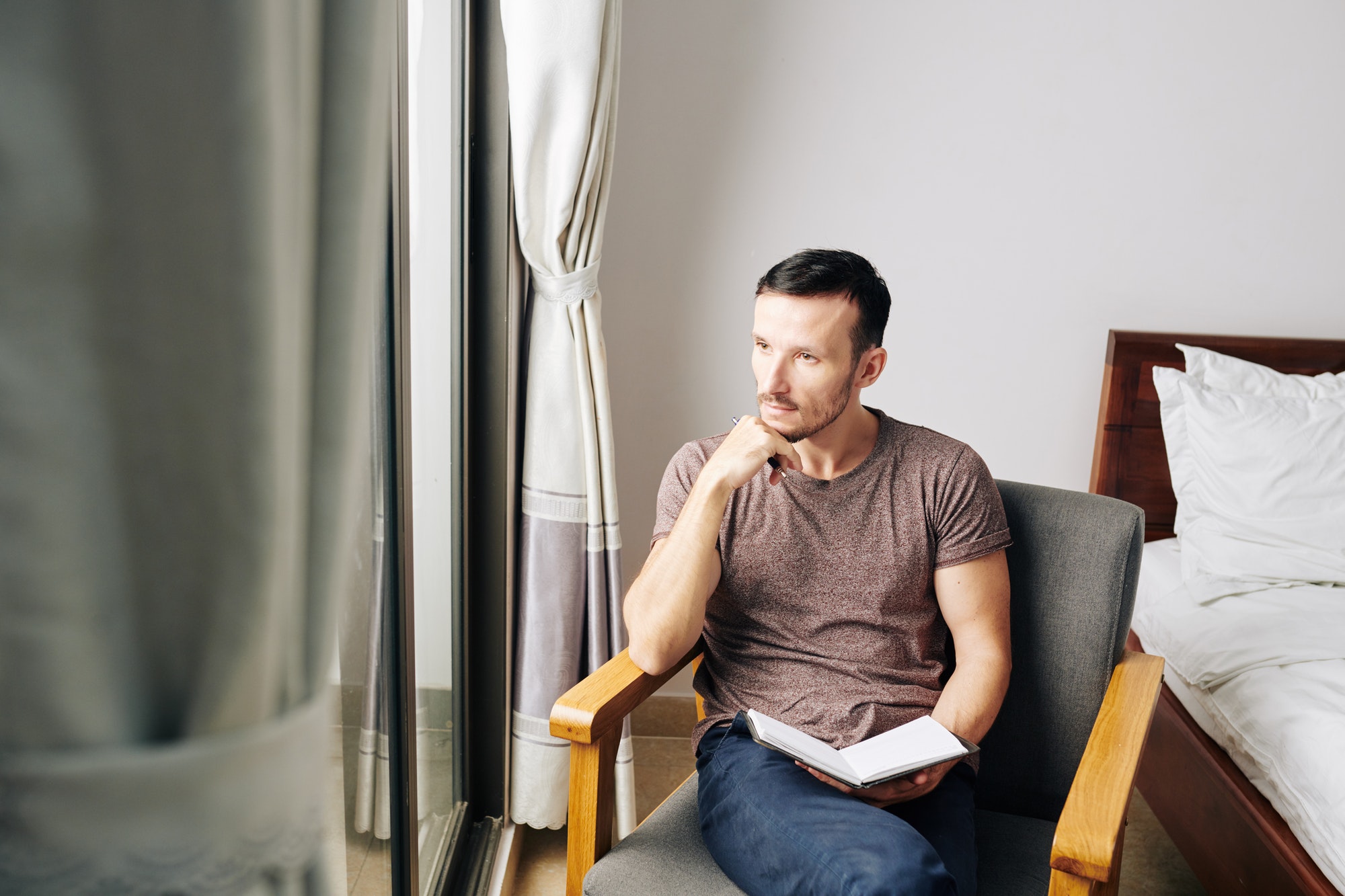 Man filling gratitude journal